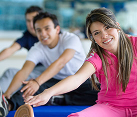 people in class stretching